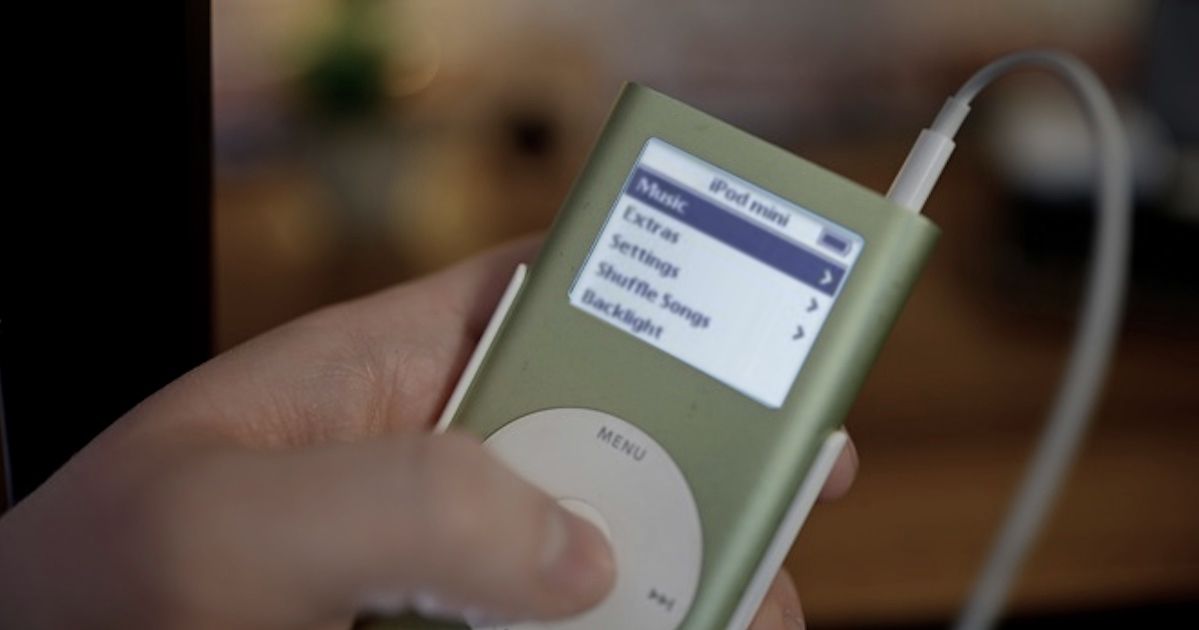 Person using and Apple iPod Mini